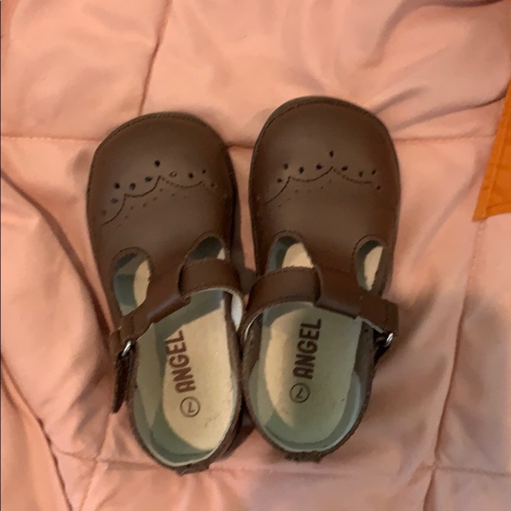 Brown T straps. Cute details on toe